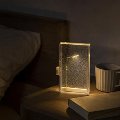 Lámpara de nieve con farola LED sobre una mesa auxiliar